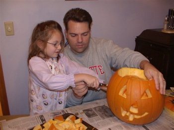 Megan and Dad Carving Pumpkins